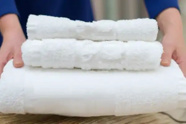 Woman Changing Hotel Room Towels Min